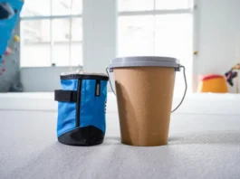 Chalk bag versus chalk bucket comparison shown side-by-side in a climbing gym setting, asking which is right for your climb.