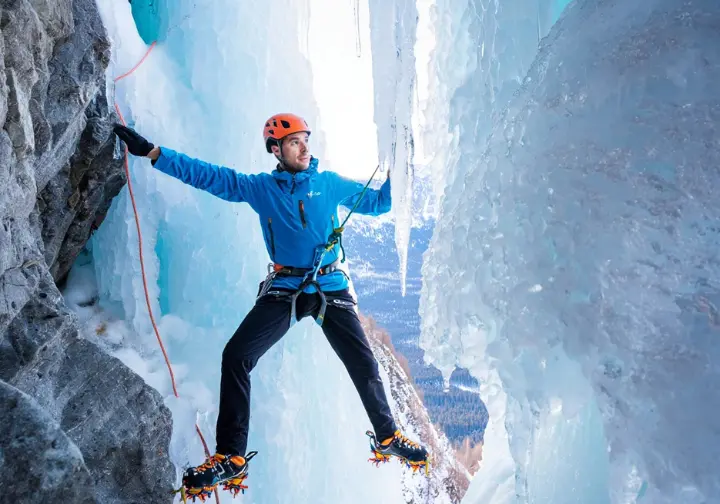 Comparison of a harness with heavy steel ice screws versus one with lightest ice screws, highlighting why every gram matters for alpinists.