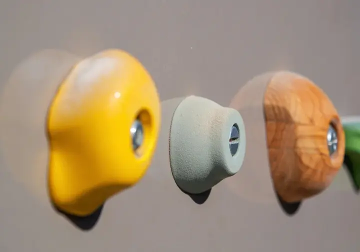Exploring climbing hold material choices: macro comparison of Polyurethane, Polyester, and Wood textures.