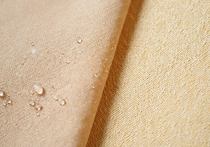 Understanding climbing pant fabric performance: macro comparison of durable synthetic and breathable cotton weaves.