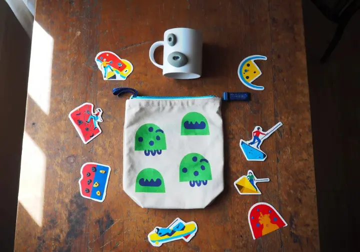 Unique climbing finds and personal touches including a monster chalk bag, hold mug, and stickers