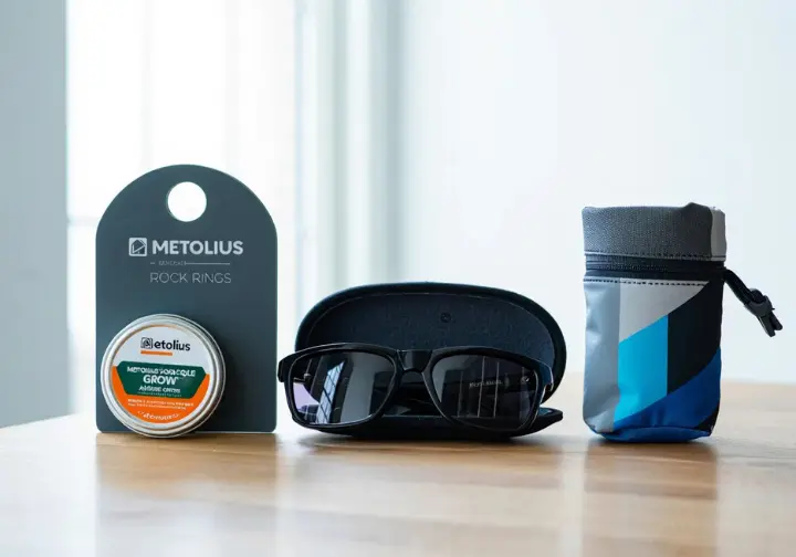 Curated product recommendations for climbing gifts: belay glasses, salve, portable hangboard, and chalk bag.