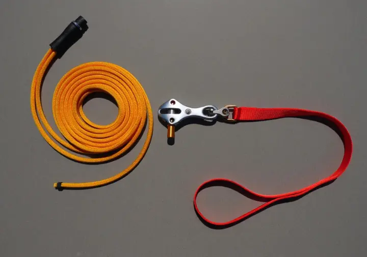 Tree climbing access and positioning tools: throwline with weight and an adjustable work positioning lanyard.