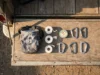 Rock Climber Gift Ideas: Fail-Safe Picks (Ranked) A curated collection of essential rock climbing gear including chalk, tape, and carabiners arranged neatly on a wooden surface.