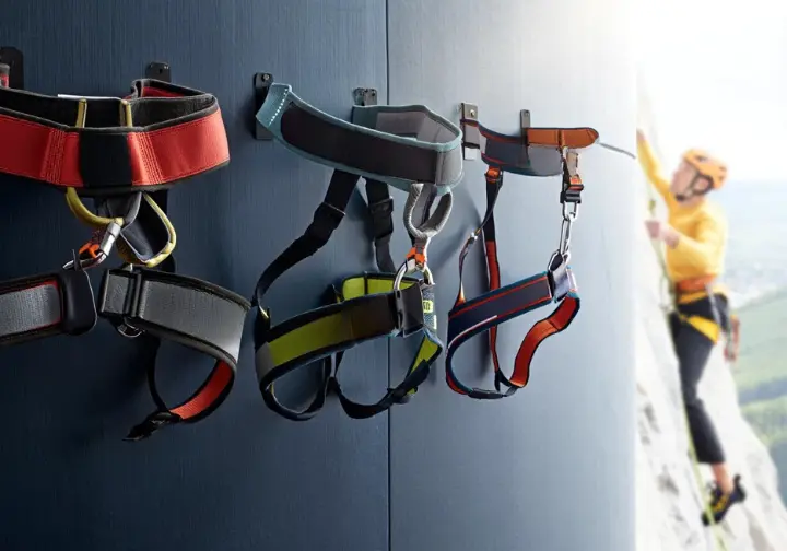 A collection of different Petzl climbing harnesses showcasing their legacy of trust and innovation in design, explaining why to choose a Petzl harness.