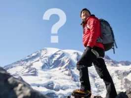 Mountaineering Rainier guide: Climber looking up at Mount Rainier, questioning if they are fit enough for the climb.