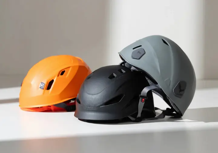 A collection of top-rated rock climbing helmets from 2025, arranged to showcase different styles and features of best rock climbing helmets.