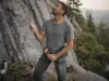 Best Belay Devices Compared One Honest Winner Climber belaying with a Petzl GRIGRI assisted-braking belay device at the base of a granite sport route