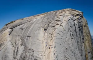 Unlock Half Dome: Yosemite Climbing In-Depth Beta Majestic panoramic view of Half Dome in Yosemite, its detailed granite face symbolizing in-depth beta for yosemite climbing half dome adventures.