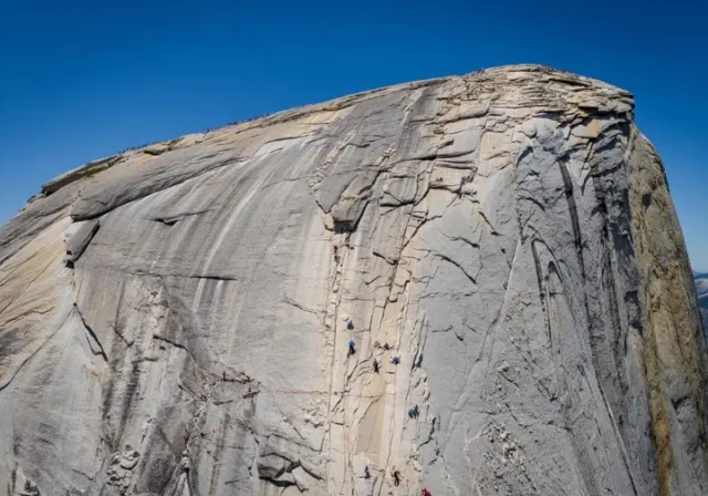 Majestic panoramic view of Half Dome in Yosemite, its detailed granite face symbolizing in-depth beta for yosemite climbing half dome adventures.