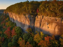 Expansive view of Red River Gorge cliffs at golden hour, hinting at the potential for a maximized climbing trip in this premier climbing destination.