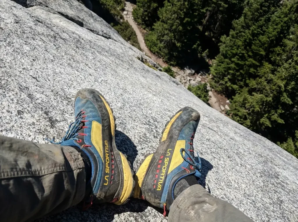 Sticky-rubber approach shoes smearing across polished granite slabs on the Half Dome approach