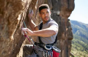 Elbow Pain in Climbers: Diagnose, Treat & Prevent It Climber experiencing elbow pain while rock climbing, needing diagnosis, treatment, and prevention for elbow pain from rock climbing.