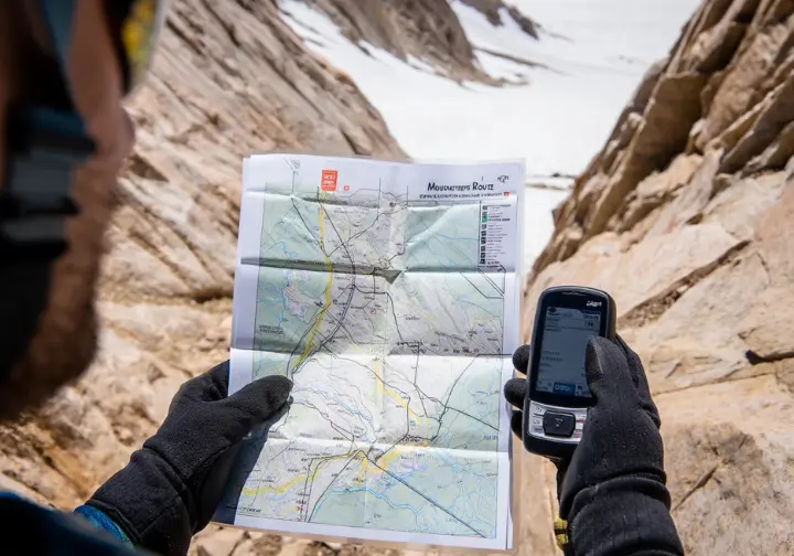 Deciphering the Mount Whitney Mountaineer's Route: a step-by-step guide visualized with a climber's POV using a map on the trail.