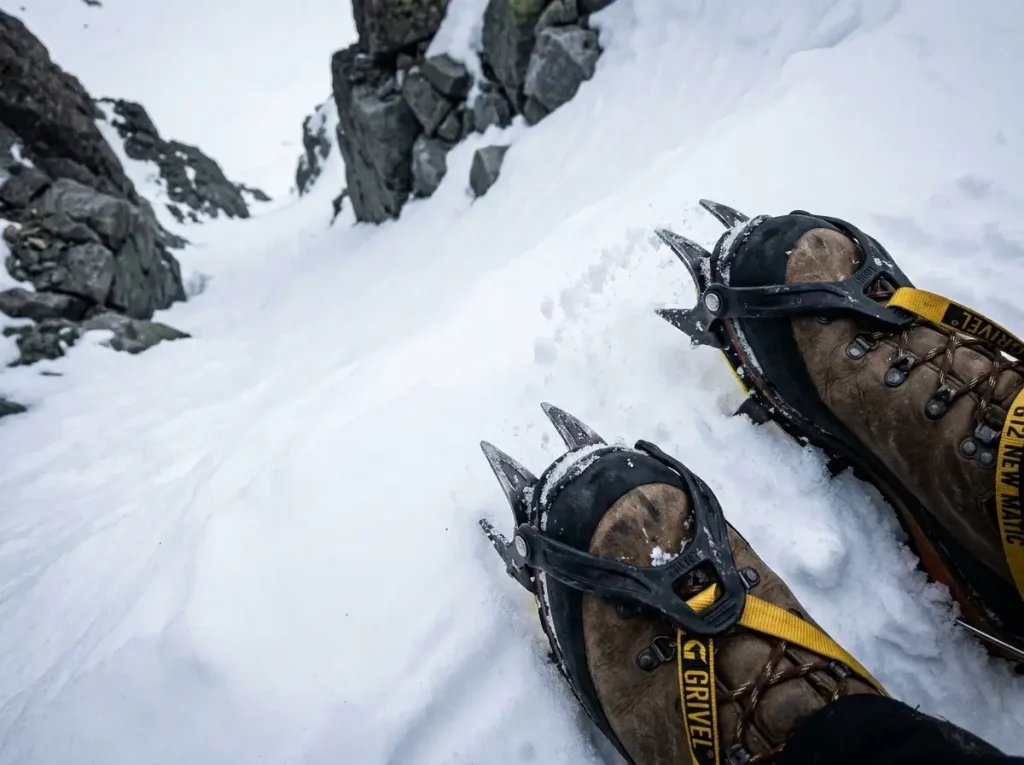 Steel crampons biting into the firm snow gully on Mount Whitney early season