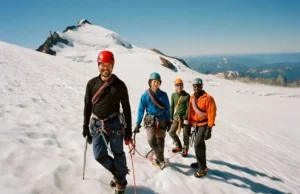 Choosing Mt Baker Climbing Guides: An Expert Review Choosing Mt Baker climbing guides: an expert review showing a diverse guided rope team ascending a glacier.