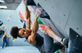 Master Core Exercises for Bouldering: Climb Stronger Master core exercises for bouldering: diverse female climber showcasing core strength on a steep overhang to climb stronger.