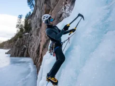 Master Lake Willoughby Ice Climbing: Routes & Conditions Mastering Lake Willoughby ice climbing: climber on a steep ice route with iconic cliffs and frozen lake, detailing routes and conditions.