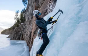 Master Lake Willoughby Ice Climbing: Routes & Conditions Mastering Lake Willoughby ice climbing: climber on a steep ice route with iconic cliffs and frozen lake, detailing routes and conditions.