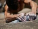 Master Rock Climbing Finger Training: Strength & Health Mastering rock climbing finger training: close-up of strong, chalked fingers gripping a rock hold, emphasizing strength and health.