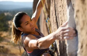 Master Strength Exercises for Climbing: Climb Harder Master strength exercises for climbing: diverse female climber powerfully moving on a steep outdoor route to climb harder.