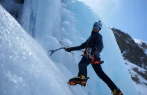 Master Training for Ice Climbing: Strength & Endurance Mastering training for ice climbing: climber showcasing strength and endurance by swinging an ice tool into a steep blue ice formation.