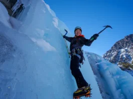 Mastering Lee Vining ice climbing: diverse female climber ascending blue ice routes amidst stunning Eastern Sierra conditions.