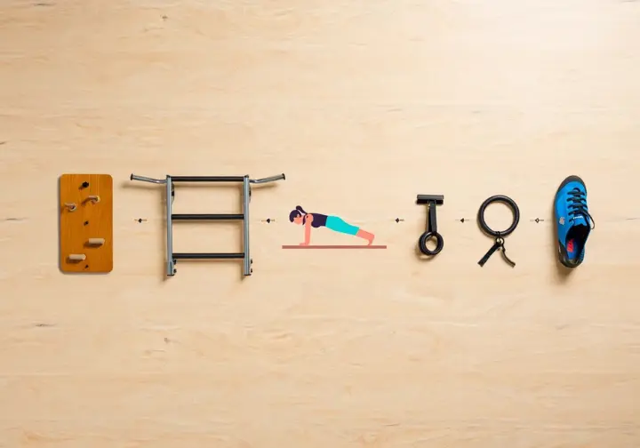 Analyzing top exercises for rock climbers: a flat lay of training equipment like hangboards and pull-up bars as contenders for the best exercise.