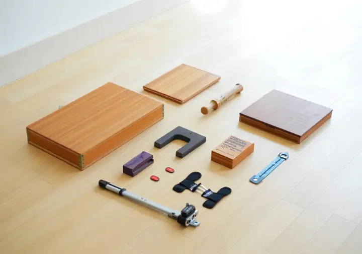Essential rock climbing finger training equipment and tools, including hangboard, campus rungs, and pinch blocks.
