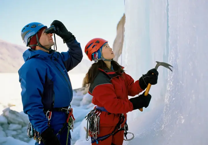 Staying safe during Lake Willoughby ice climbing: diverse climbers assessing ice conditions and potential hazards.
