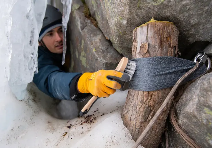 Preserving Lake Willoughby's ice: climber practicing stewardship and Leave No Trace ethics in the climbing environment.