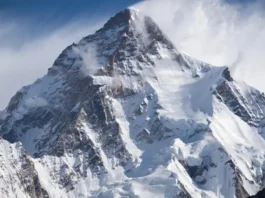 Beyond Everest: The imposing, stormy peak of K2, representing the debate over the most difficult mountain to climb.