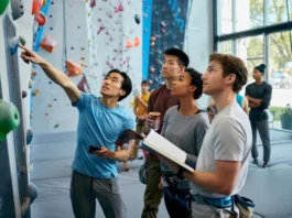 Choosing a Berkeley rock climbing gym: diverse climbers thoughtfully reviewing options in a modern gym, an expert review.