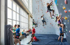 Climbing Gym San Francisco: Which Fits Your Vibe? Diverse climbers bouldering and rope climbing in a bright San Francisco gym, representing choosing a gym that fits your vibe.