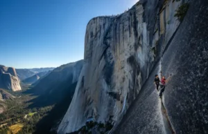 Conquer Freerider El Capitan: Route Plan Panoramic view of El Capitan with the Freerider route subtly highlighted and two tiny climbers, illustrating a comprehensive route plan.