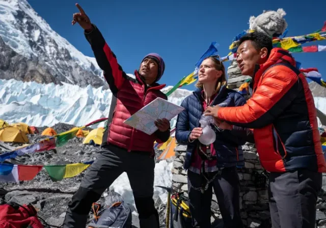 Expedition planners discussing logistics at Everest Base Camp, illustrating the definitive best time to climb Everest.
