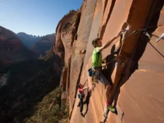 Master Zion Rock Climbing: Big Walls, Routes & Permits Mastering rock climbing in Zion: climbers on a big wall, showcasing routes, permits, and respect for Zion National Park.