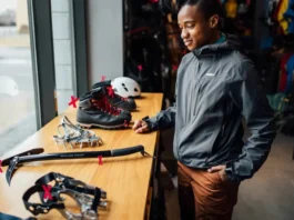 Person considering essential mountain climbing gear, highlighting the need to choose correctly and avoid mistakes.