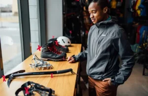 Need Gear for Mountain Climbing? Avoid Mistakes! Person considering essential mountain climbing gear, highlighting the need to choose correctly and avoid mistakes.