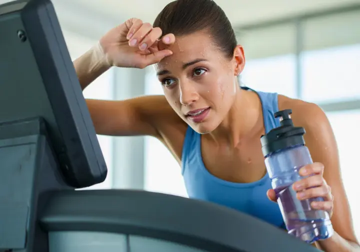 Understanding keto exercise effects: Person showing slight fatigue during workout, representing the keto adaptation phase.