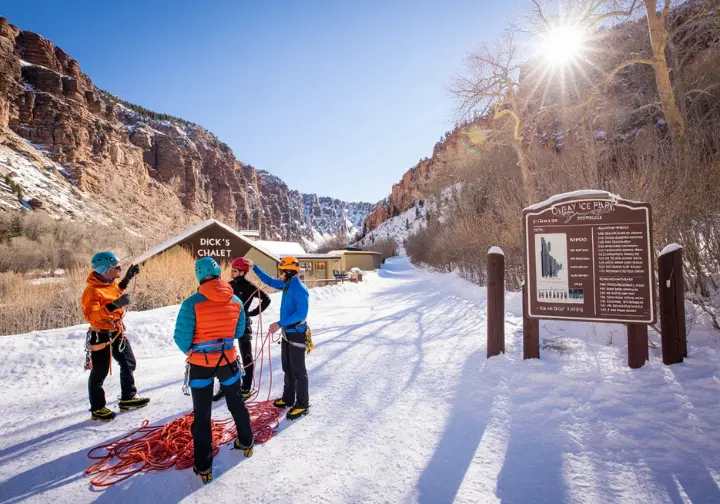Planning your Ouray Ice Park visit: View of the main entrance area with access path, signage, and chalet.