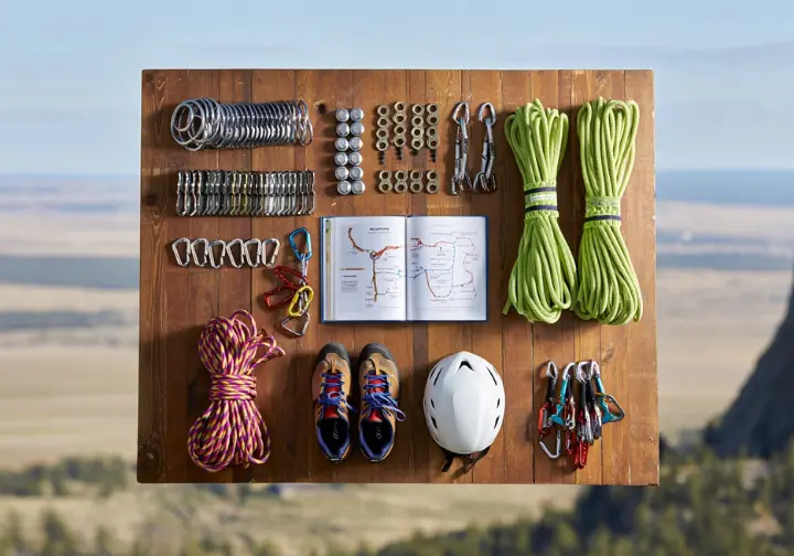 Practicalities for climbing Devils Tower, Wyoming: flat lay of essential trad gear, covering logistics and safety.