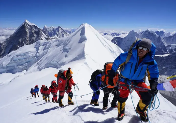 Diverse climbers ascending Everest during the pre-monsoon spring season, the primary window and best time to climb.