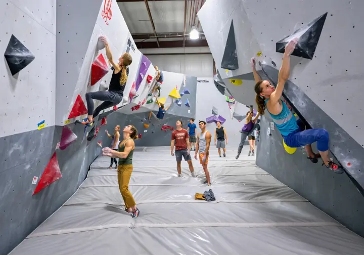 Dogpatch Boulders (Touchstone) deep dive: Wide view of the expansive, busy bouldering area with modern walls.