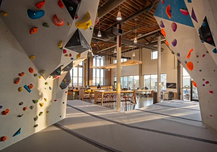 Benchmark Climbing deep dive: Modern interior of the gym highlighting quality route setting and community workspace vibe.