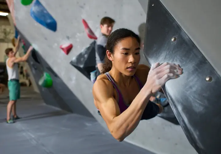 Review of Bridges Rock Gym (El Cerrito): diverse female climber training on a MoonBoard, a worthwhile trip from Berkeley.