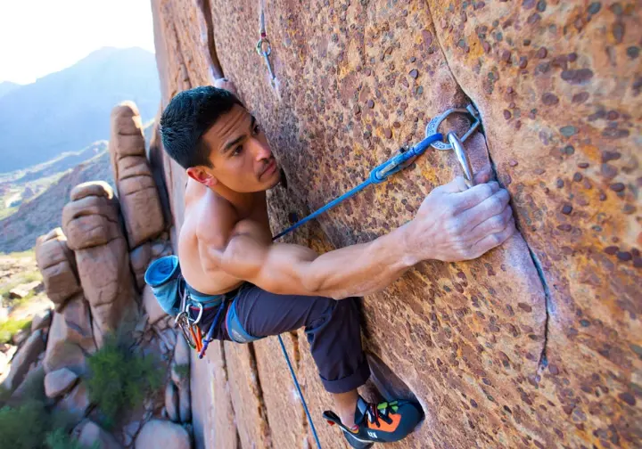 Key climbing routes on the Praying Monk, Camelback Mountain: climber on the popular East Face 5.6 sport route.