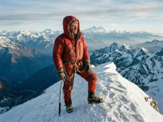The Most Difficult Mountain to Climb Isn’t Everest Mountaineer on a corniced summit ridge, the most difficult mountain to climb framed at altitude