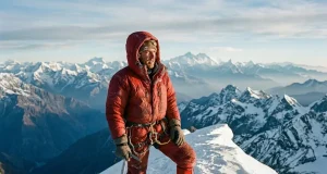 The Most Difficult Mountain to Climb Isn’t Everest Mountaineer on a corniced summit ridge, the most difficult mountain to climb framed at altitude