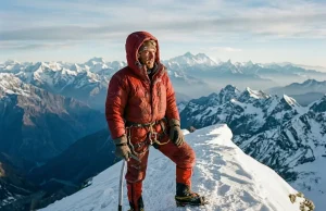 The Most Difficult Mountain to Climb Isn’t Everest Mountaineer on a corniced summit ridge, the most difficult mountain to climb framed at altitude